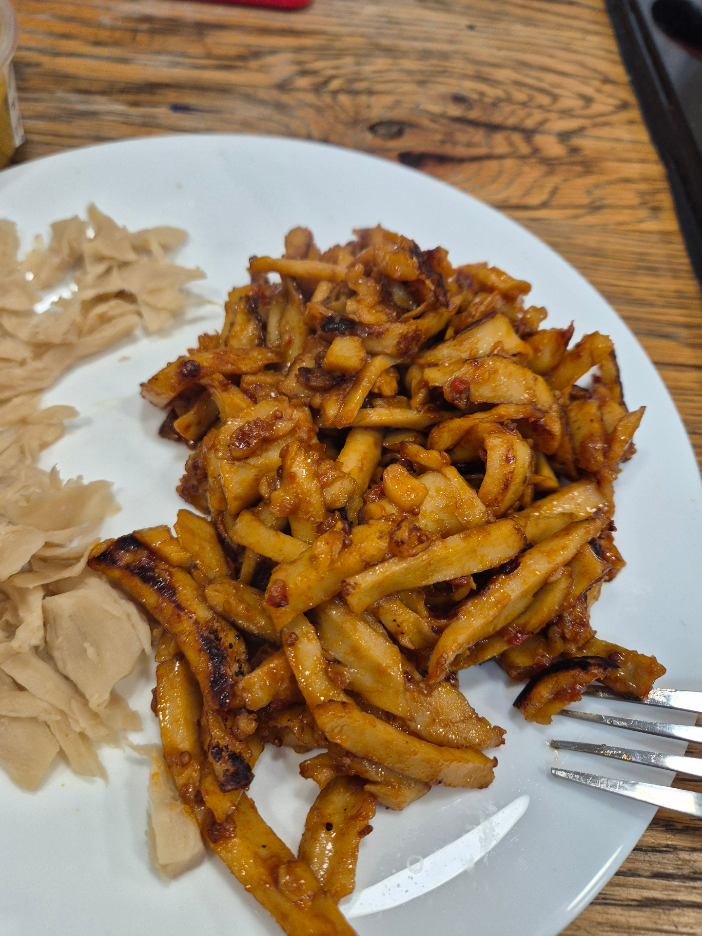 Seared strips of Provero shawarma with pita on a wooden table